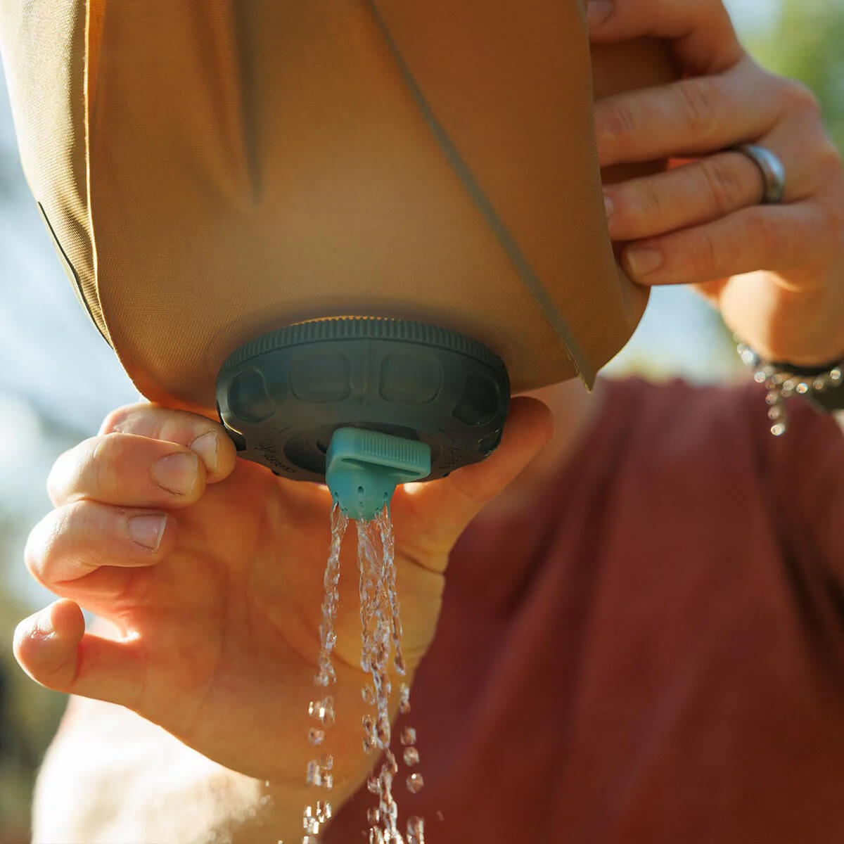 In use in the outdoors with shower fitting attached